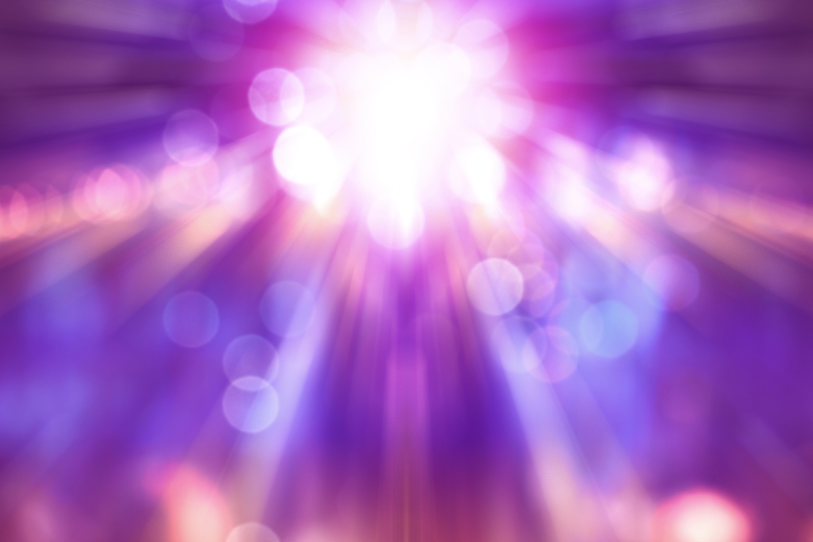 blurred theatre show with purple light on stage, abstract image of concert lighting